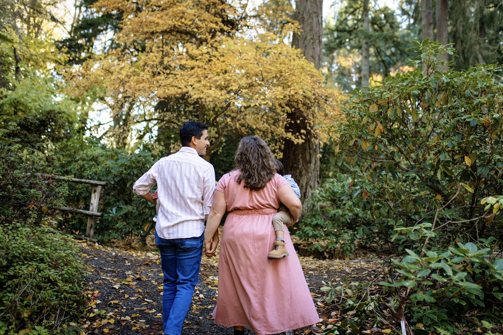 The Medina family walking together through the forest