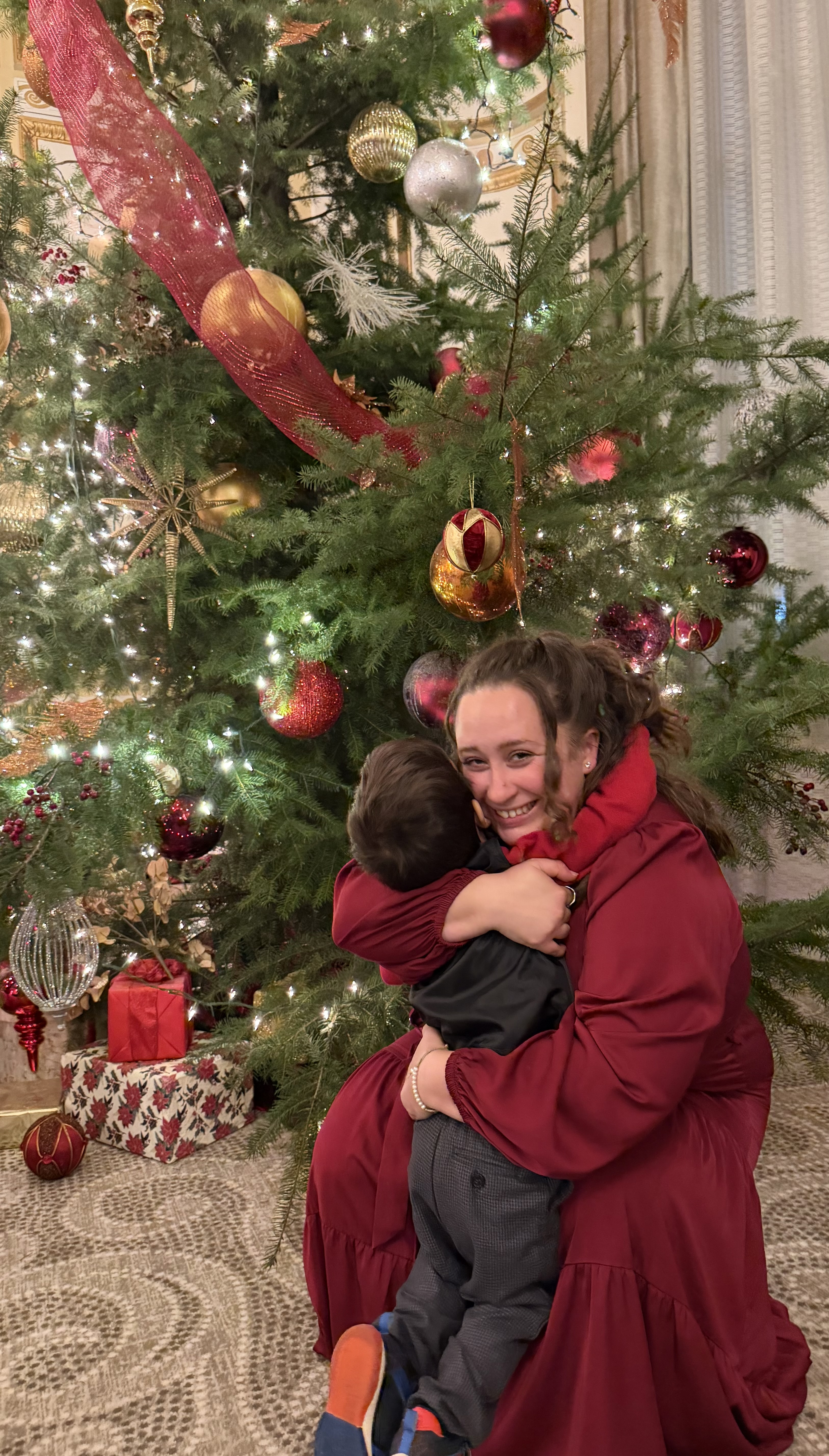 Family enjoying holiday lights and festive decorations together