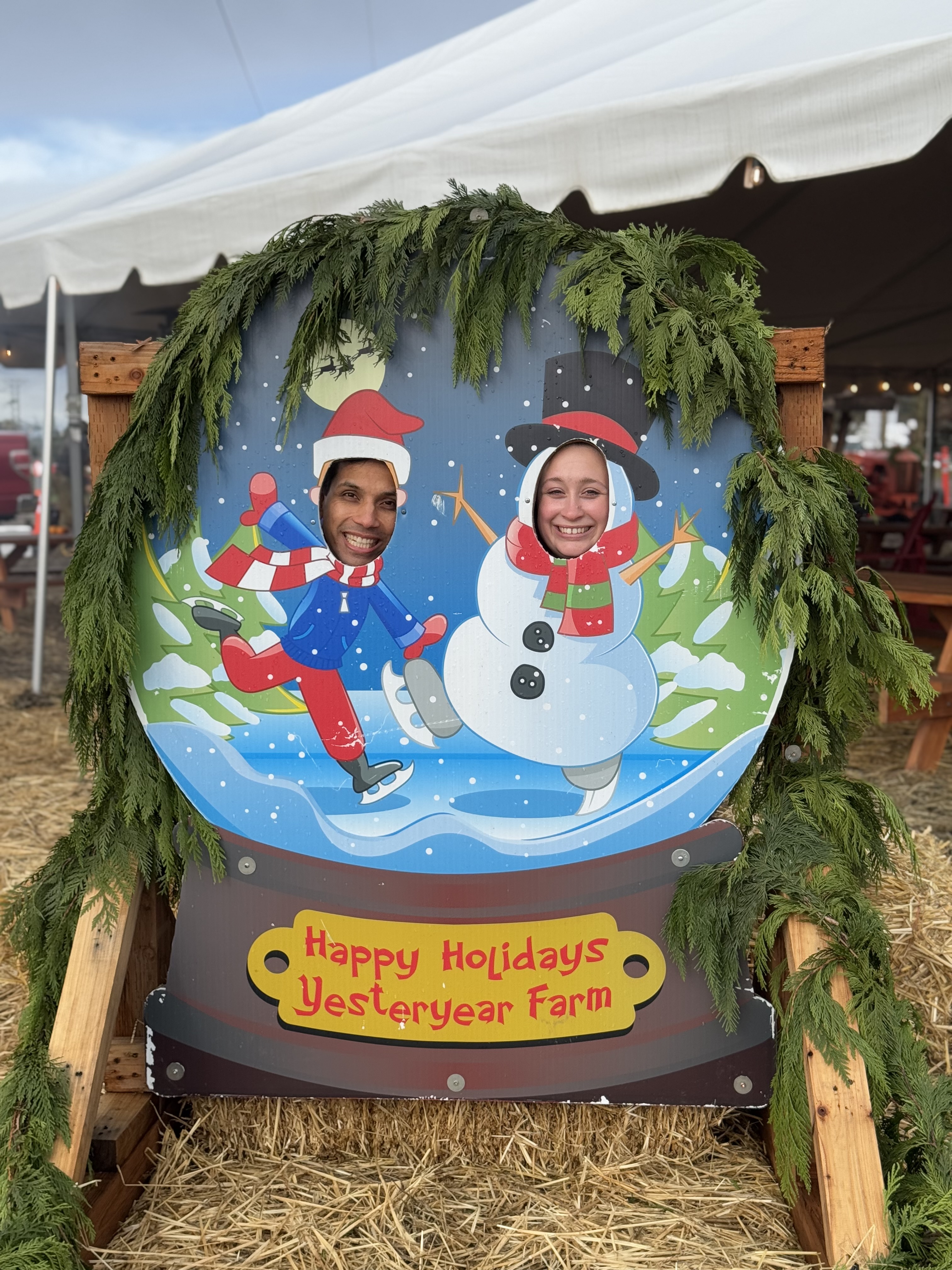 Toddler meeting Santa and Frosty the Snowman at Yesteryear Farms