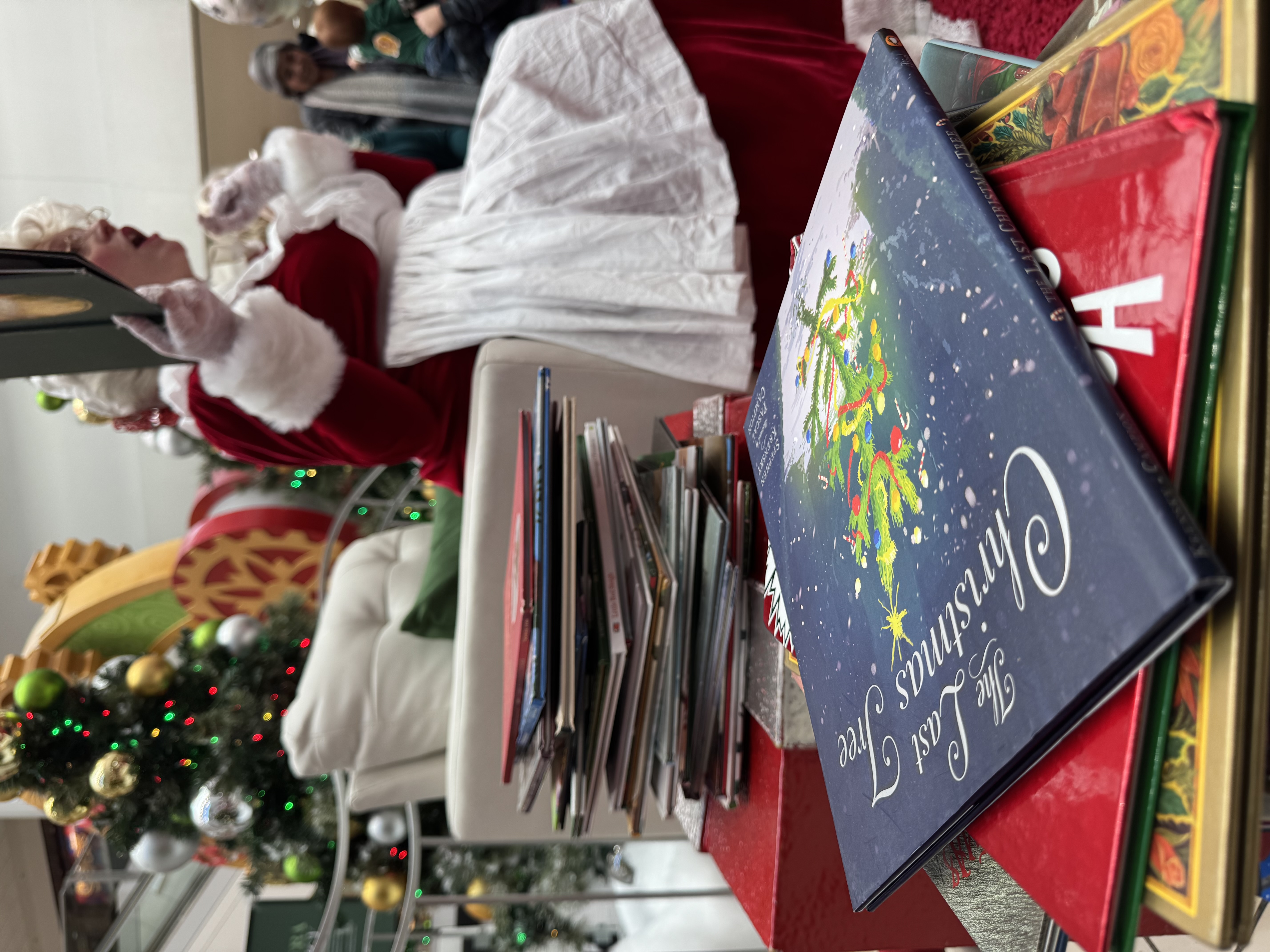 Children gathered around Mrs. Claus during storytime at the mall
